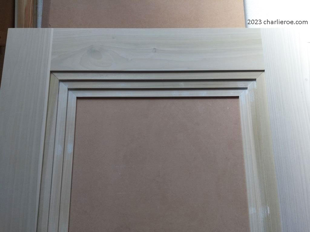 new bespoke Art Deco wood interior door with stepped door mouldings finished prior to priming