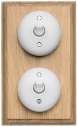 Art Deco 1920's style white bakelite double light switch on light oak finish patress backplate