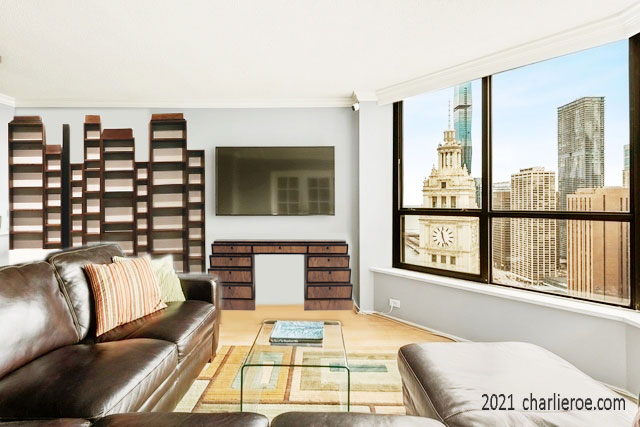 New Paul Frankl Art Deco Skyscraper style painted lacquered bookcase in black with silver edges shown in a Chicago condo