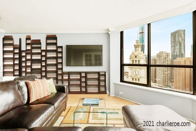 New Paul Frankl Art Deco Skyscraper style painted lacquered bookcase in black with silver edges shown in a Chicago condo
