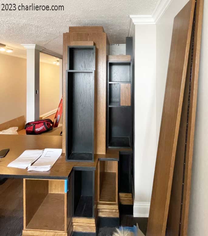 The new Paul Frankl Art Deco Skyscraper style wooden & painted lacquered bookcase desk/table being installed in the appartment