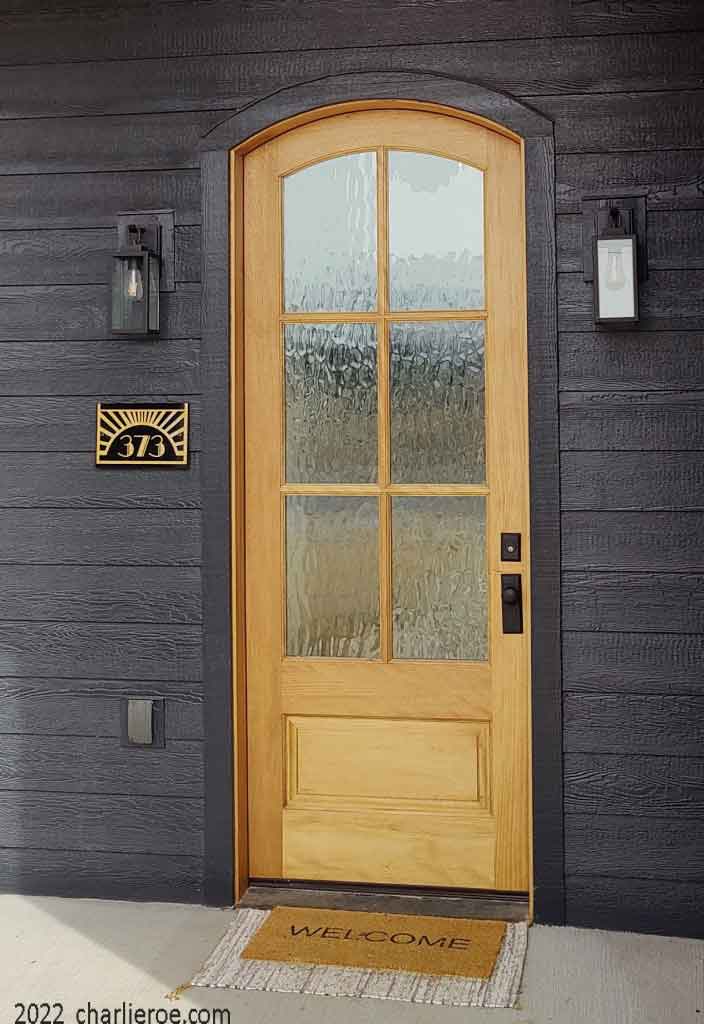 new Art Deco House number name sign with gold on boarded wall in USA