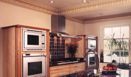 Arts and crafts movement fitted kitchen furniture in cherry & maple