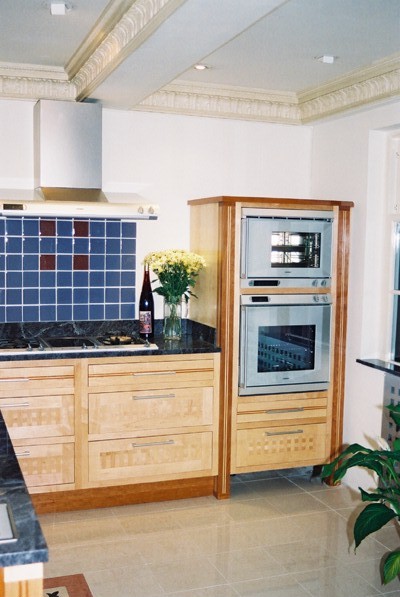 Arts and crafts movement fitted kitchen furniture in cherry & maple