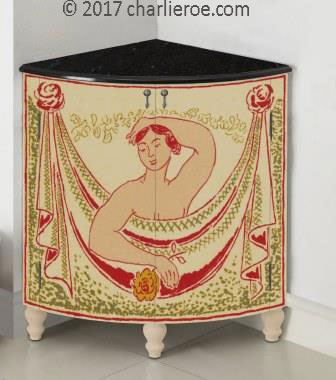 new Bloomsbury Group style painted quadrant corner cupboard on turned legs with woman and swag design on the doors
