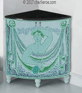 new Bloomsbury Group style painted quadrant corner cupboard on turned legs with woman and swag design on the doors