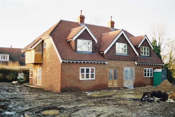 The new house, while nearing completion, is still a building site