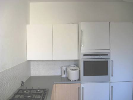 bespoke white wall unit in Maple & white contemporary fitted kitchen