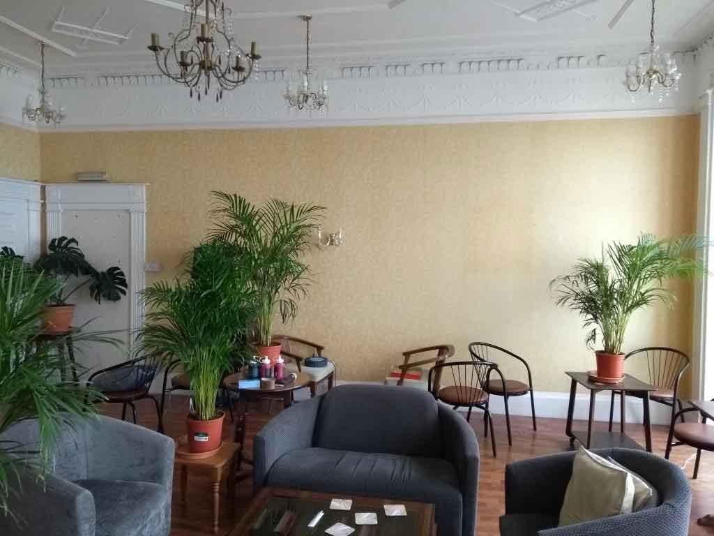 1st floor living room in a prestigous Georgian hotel, the new bookcases & sideboard are to go along this long wall