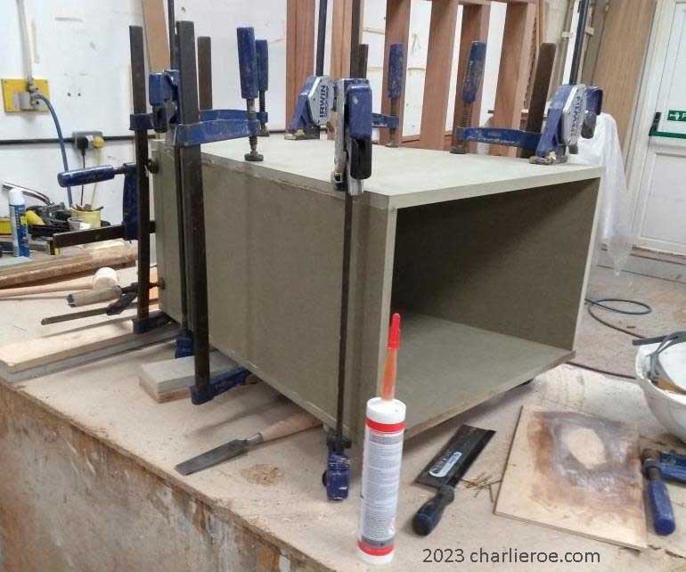 new ancient Egyptian Revival style Pylon shaped painted console table cabinet being constructed