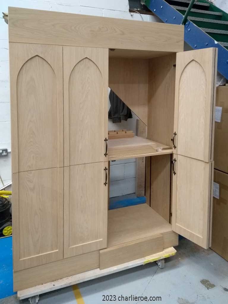 new Gothic Revival Gothique Gotik breakfront dark wood bookcases & entertainment media centre TV unit with bi-fold doors and lancet arches